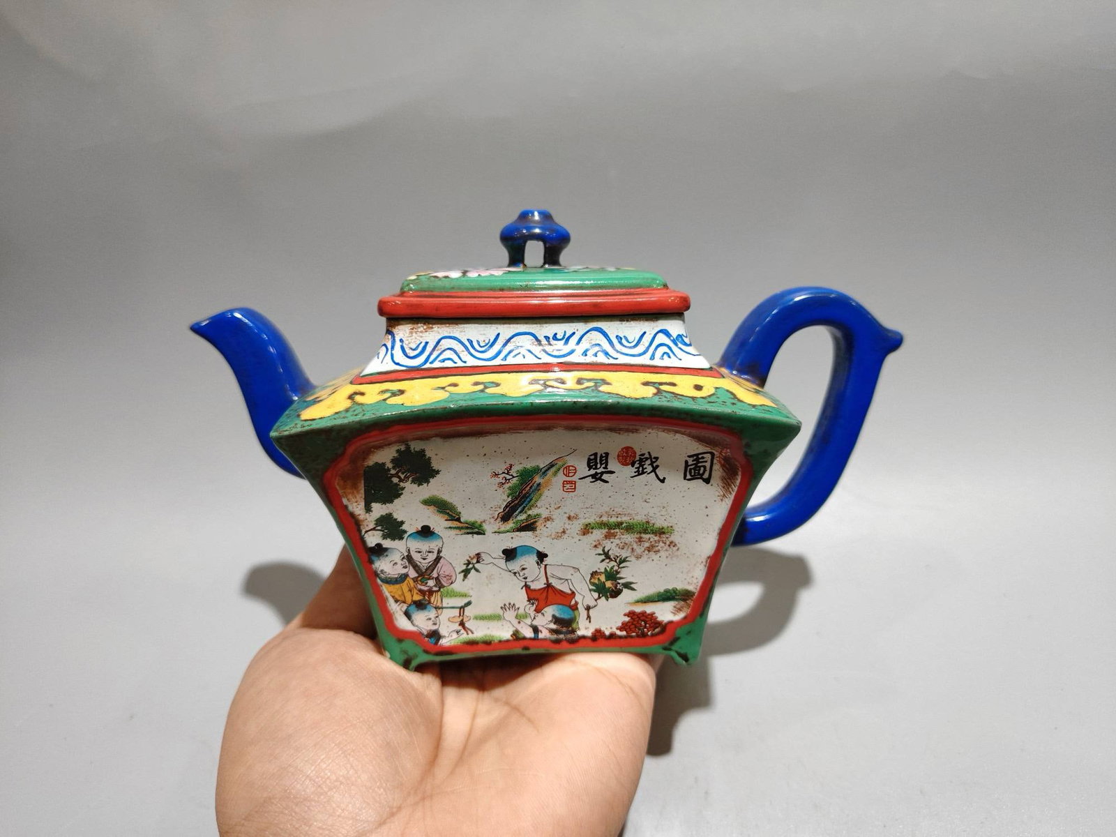Spotted Fan-Shaped Teapot with Children Playing Design: Spotted Fan-Shaped Teapot with Children Playing DesignBottom Mark: Wu YungenSize: 19/12cm...Capacity: 320ccClay: Original Red Clay