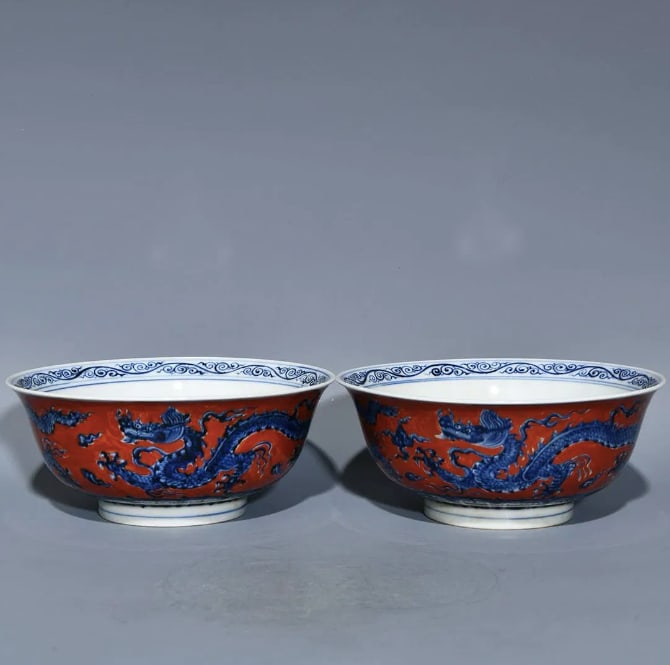A Ming Dynasty Xuande period iron-red and blue-and-white porcelain bowl: A Ming Dynasty Xuande period iron-red and blue-and-white porcelain bowl with dragon design, 7.8cm high and 18.2cm in diameter.