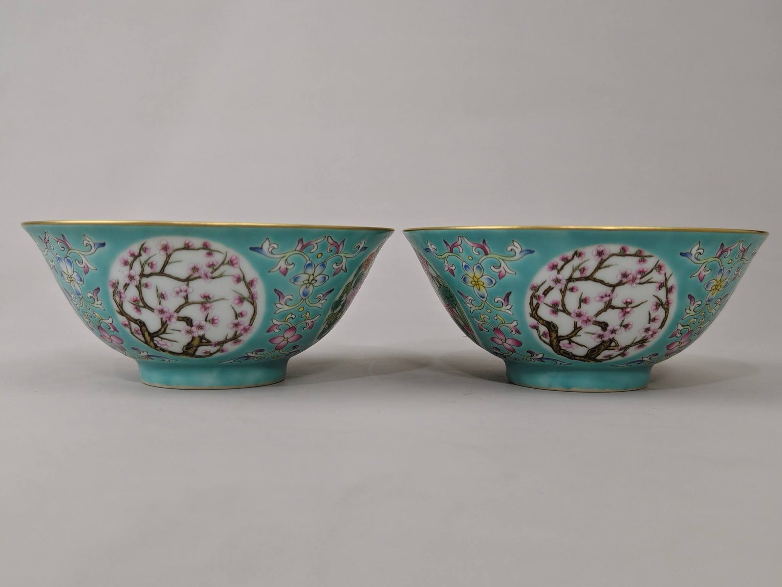A turquoise-green bowl with a window depicting seasonal flowers: A turquoise-green bowl with a window depicting seasonal flowers, made during the Qianlong period of the Qing Dynasty. Height: 6.3 cm, Diameter: 14.6 cm.