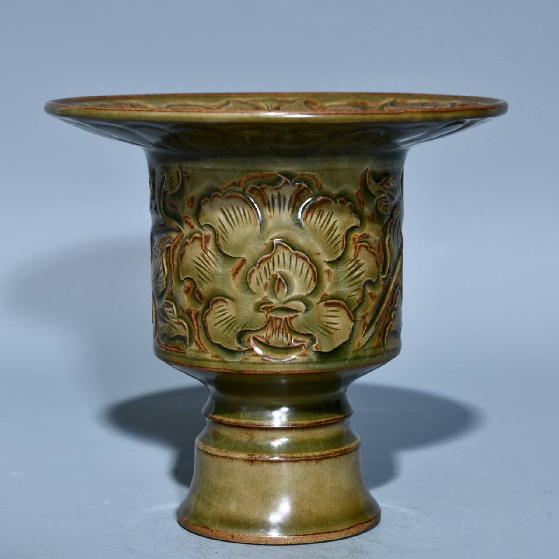 A Song Dynasty Yaozhou ware spittoon with carved floral design: A Song Dynasty Yaozhou ware spittoon with carved floral design, 13.5cm high and 14.5cm in diameter.
