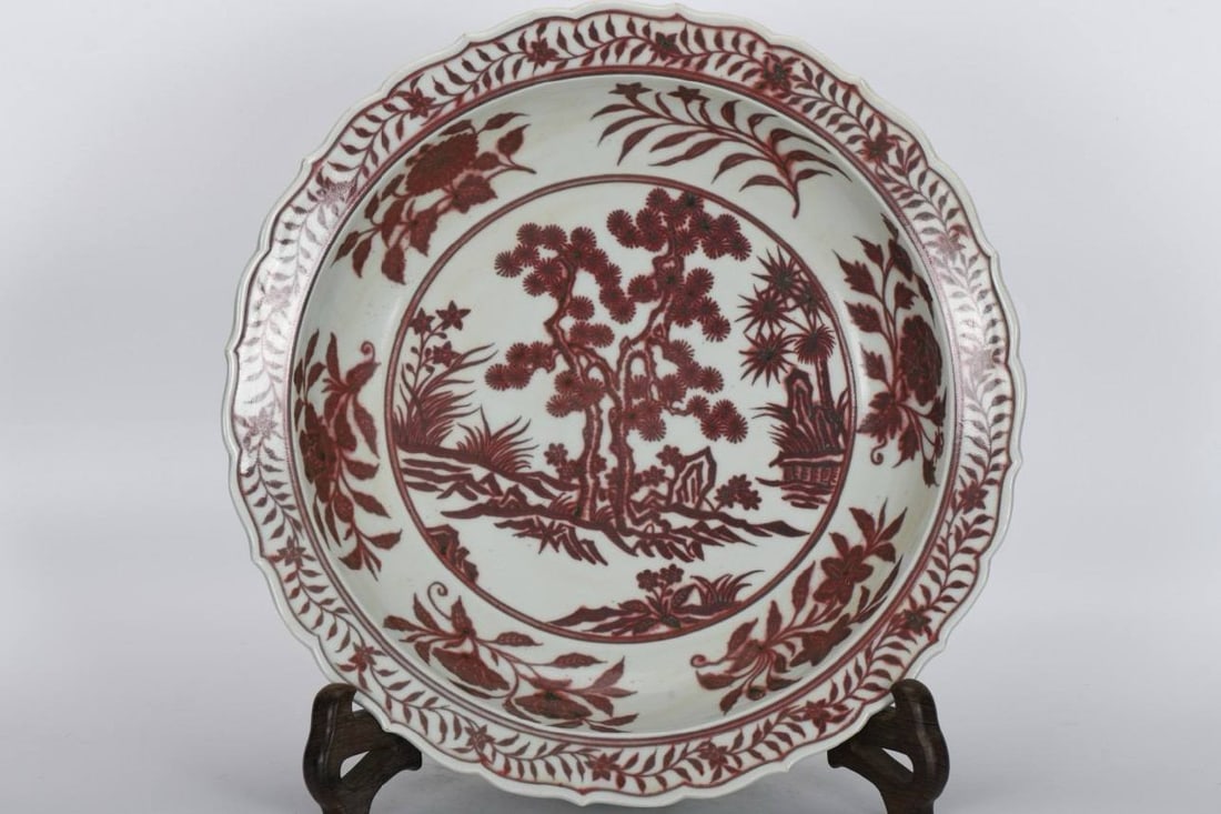 A Ming Dynasty Xuande period underglaze red Three Friends dish: A Ming Dynasty Xuande period underglaze red Three Friends dish, 8 cm high and 42.2 cm in diameter, made in the Chai kiln.