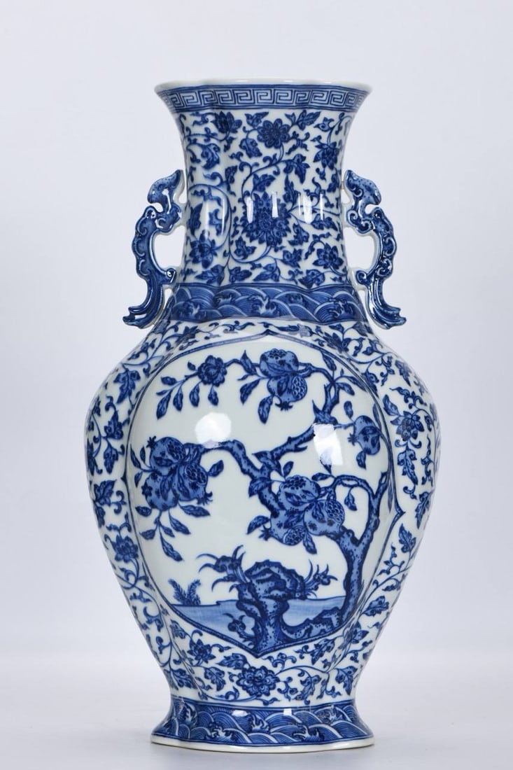 A Qing Dynasty Qianlong period blue and white porcelain vase: A Qing Dynasty Qianlong period blue and white porcelain vase with double handles and a windowed design, measuring 43 cm in height, 22.6 cm in belly diameter, and 14.3 cm in base diameter.