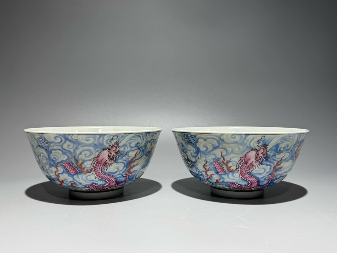 A famille rose bowl with a dragon, cloud, and wave design: A famille rose bowl with a dragon, cloud, and wave design, decorated with lychees inside, bearing the mark of the Qianlong period (1720). Height: 7cm; Width: 14.3cm