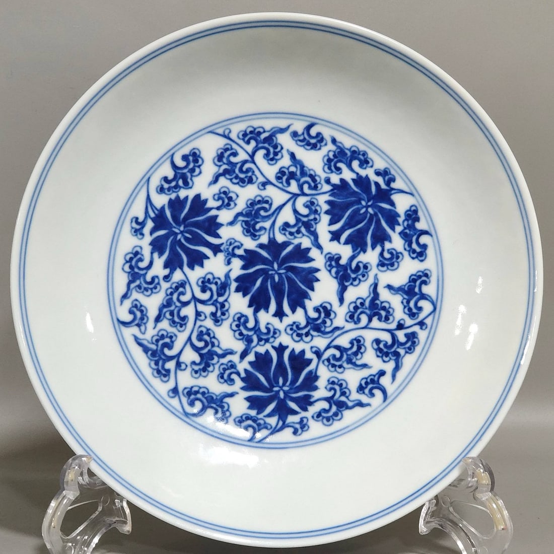A Qing Dynasty Daoguang period lotus-patterned plate: A Qing Dynasty Daoguang period lotus-patterned plate, 4 cm high and 19.5 cm in diameter.