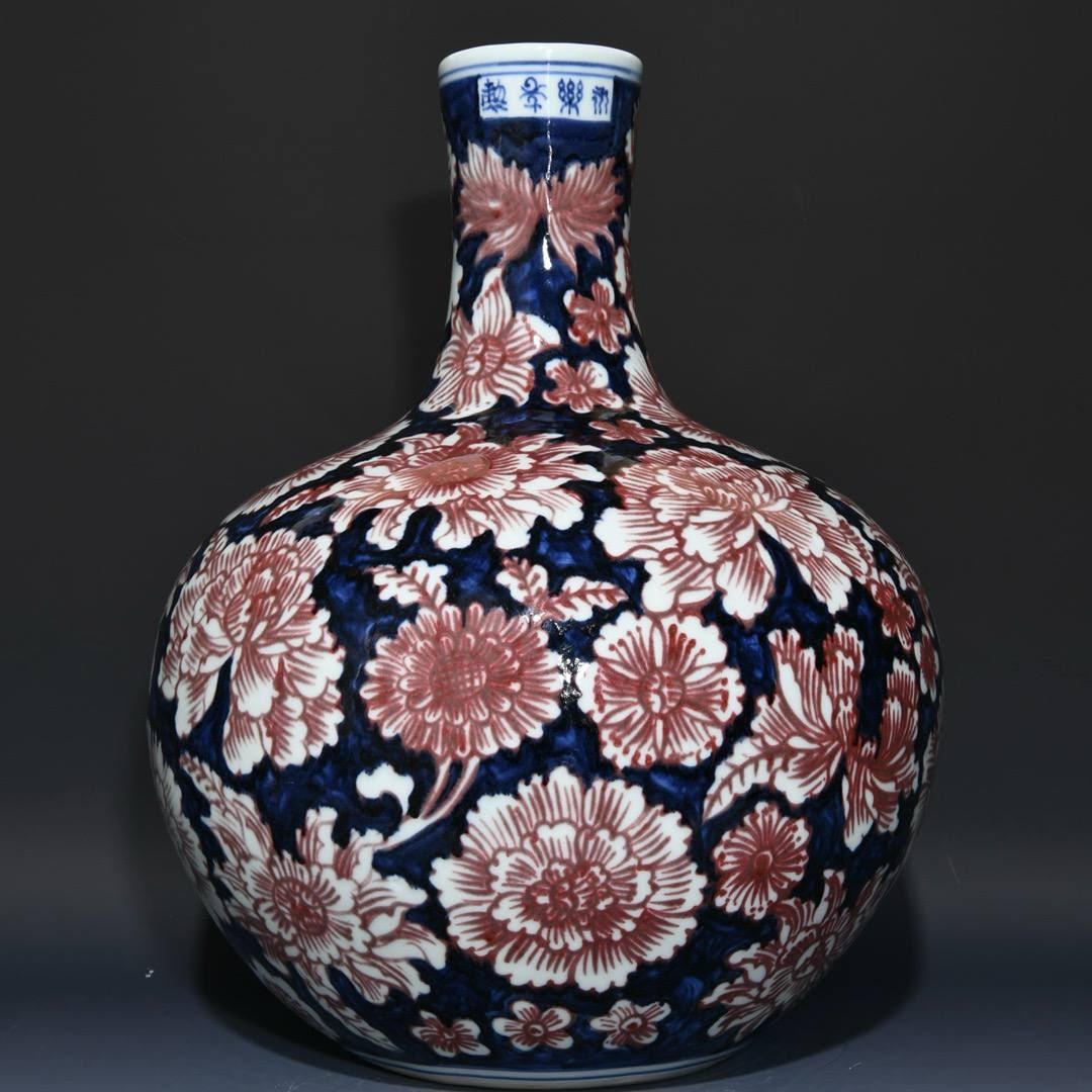 A Ming Dynasty Yongle period blue-and-white underglaze red floral-patterned celestial globe vase: A Ming Dynasty Yongle period blue-and-white underglaze red floral-patterned celestial globe vase, 42cm high and 32.5cm in diameter.