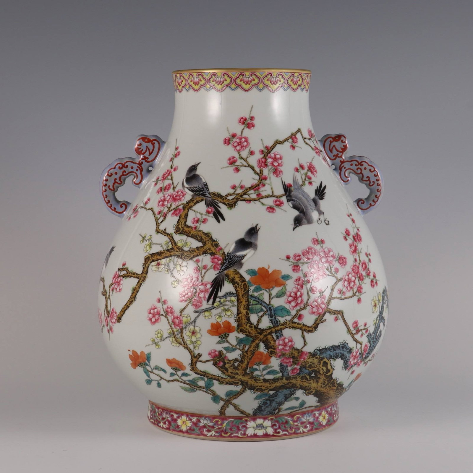 A famille rose vase with floral and bird design: A famille rose vase with floral and bird design and inscribed poem, made during the Yongzheng period of the Qing dynasty. Dimensions: Height 32 cm, Belly diameter 26 cm, Mouth diameter 12.5 cm.
