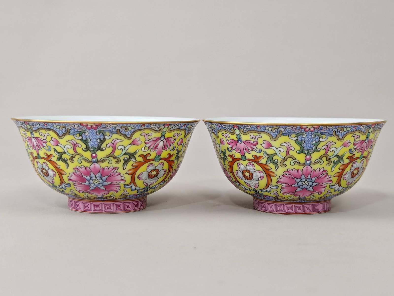 A famille rose cup with lotus and phoenix design: A famille rose cup with lotus and phoenix design, bearing the mark of the Yongzheng reign of the Qing Dynasty. It measures 4.4 cm in height and 8.9 cm in diameter.