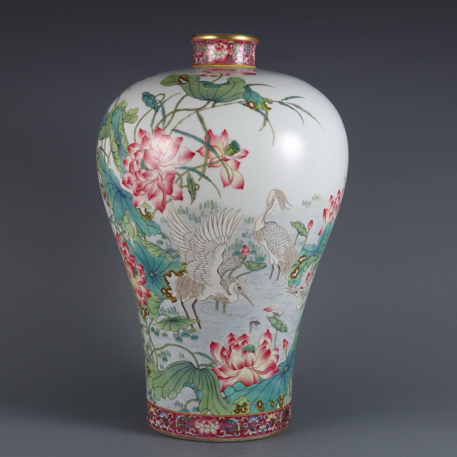 A large famille rose plum vase: A large famille rose plum vase with an egret and lotus design, inscribed with a poem, made during the Yongzheng period of the Qing dynasty. Dimensions: Height 39 cm, Mouth Diameter 6.6 cm.