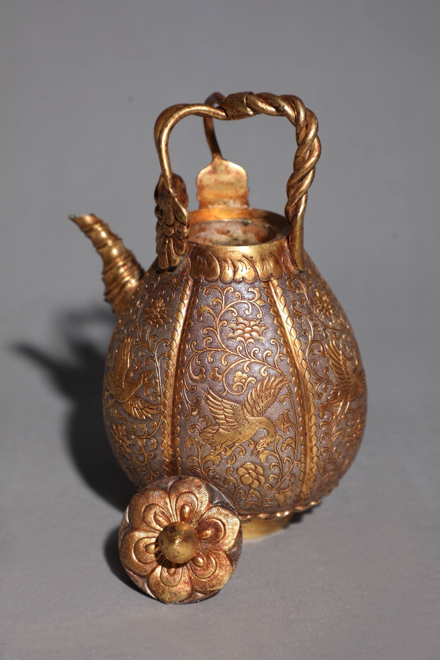 A Qing Dynasty Gilt Silver Ewer with Phoenix and Luan Design: Size:Height 16cm, Mouth Diameter 4.5cm, Belly Diameter 9.5cm, Ear Spacing 11cm, Weight 400g