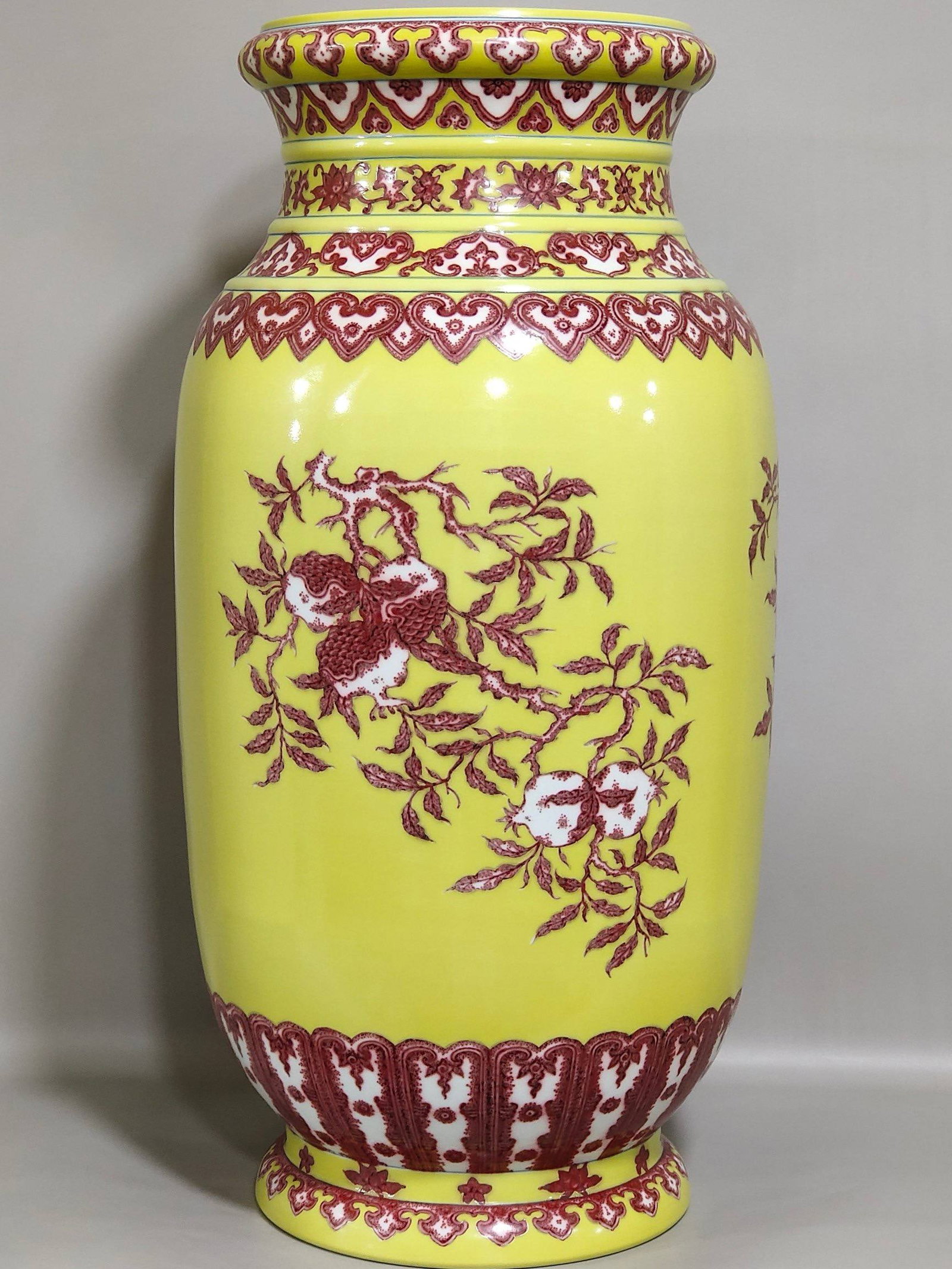 A Qing Dynasty Qianlong period underglaze red and yellow "Three Abundances" barrel vase: A Qing Dynasty Qianlong period underglaze red and yellow "Three Abundances" barrel vase, 48.5 cm high and 22.5 cm in diameter.