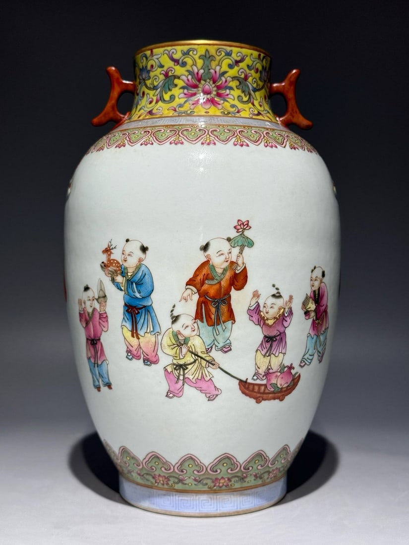A famille rose vase with a design of children at play and double-handled: A famille rose vase with a design of children at play and double-handled gourd shape, bearing the mark of the Jiaqing period of the Qing dynasty. Height: 25cm, Width: 15.5cm