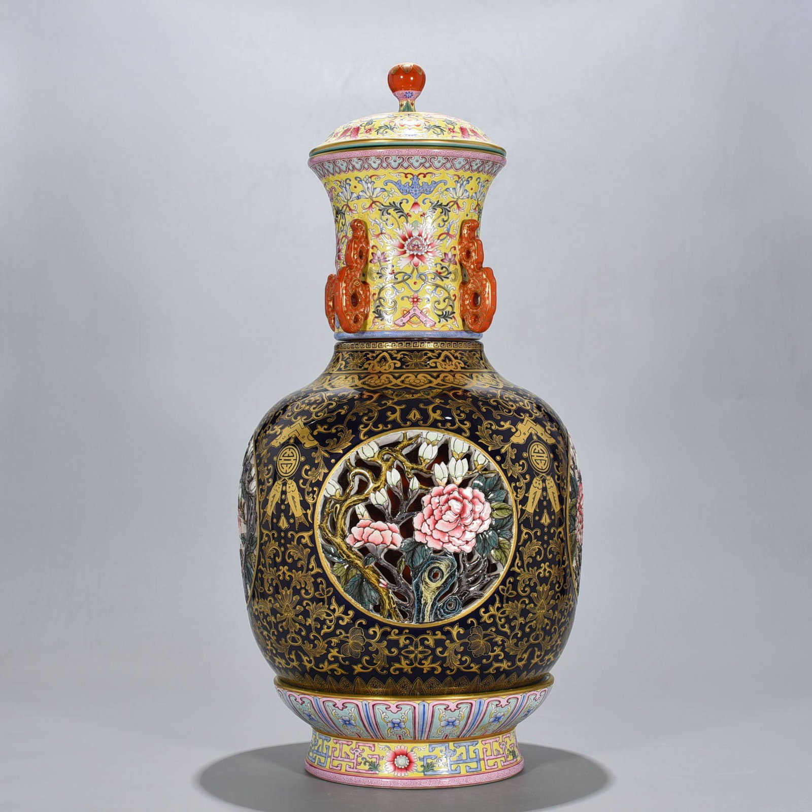 A Qing Dynasty Qianlong period sacrificial blue glaze revolving vase: A Qing Dynasty Qianlong period sacrificial blue glaze revolving vase with gilt openwork floral design depicting the four seasons, measuring 63 x 30 cm.