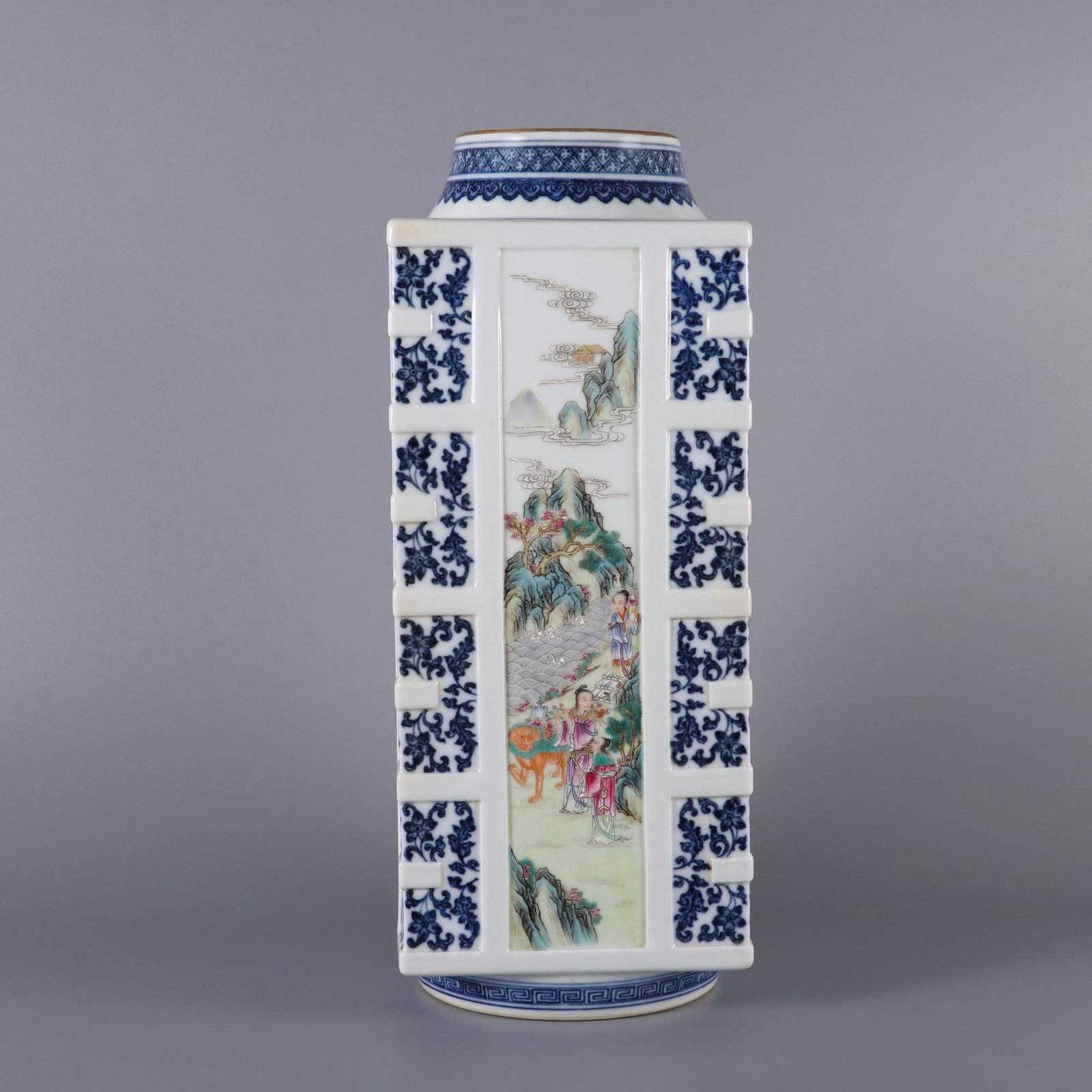A Qing Dynasty Qianlong period blue and white porcelain vase: A Qing Dynasty Qianlong period blue and white porcelain vase with a lotus scroll design and famille rose enamels depicting immortals celebrating longevity. Dimensions: Height 36.2 cm, Belly diameter 1
