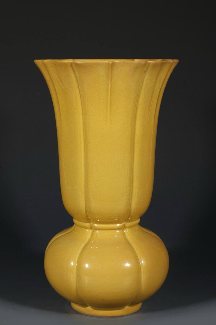 A Qing dynasty Guangxu period (1470s) glazed vase: A Qing dynasty Guangxu period (1470s) glazed vase with a delicate yellow glaze and a design of white cabbage (symbolizing wealth). Height: 31cm, Width: 17.8cm