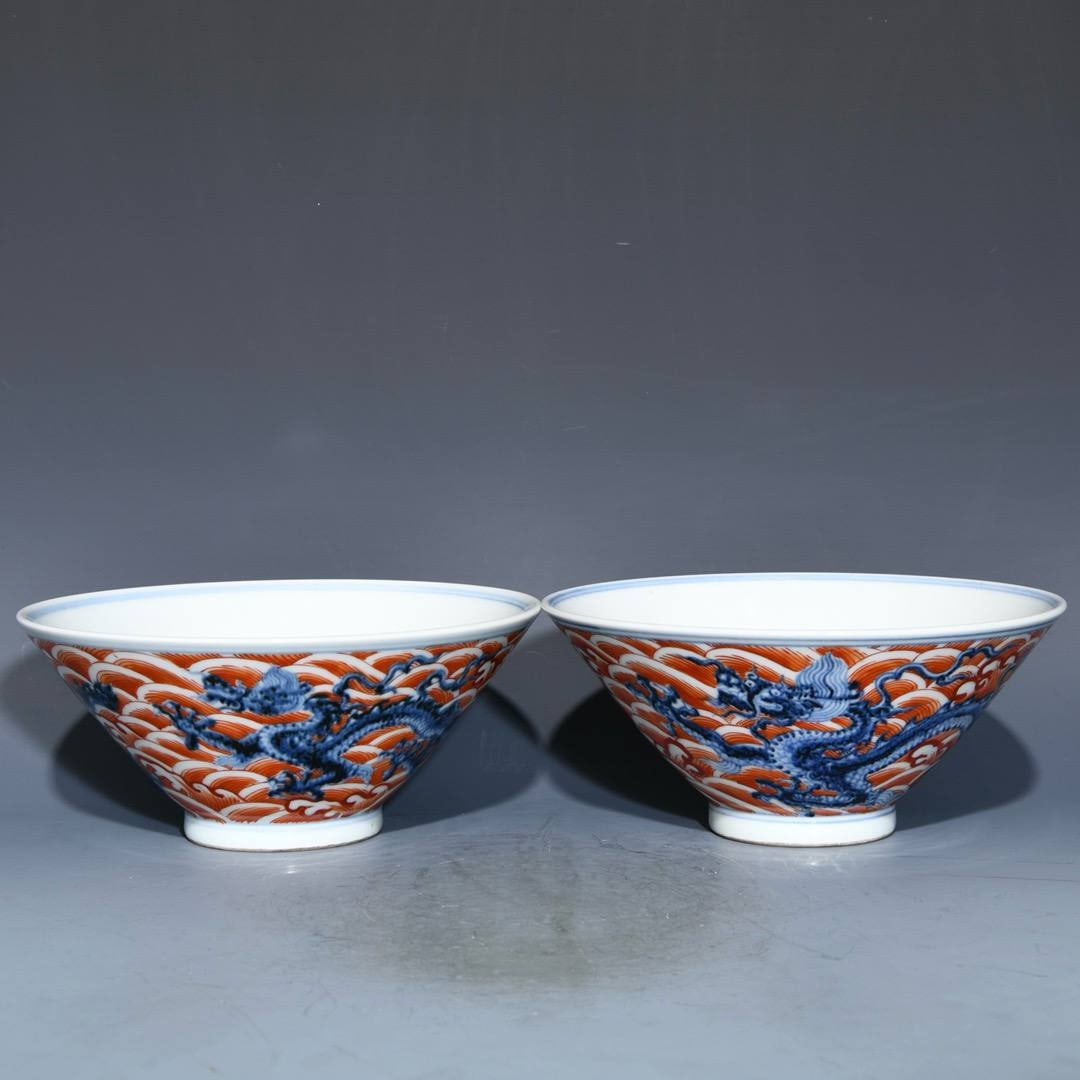 A Ming Dynasty Xuande period blue and white porcelain bowl: A Ming Dynasty Xuande period blue and white porcelain bowl with iron-red dragon design, 9.5cm high and 20.6cm in diameter.