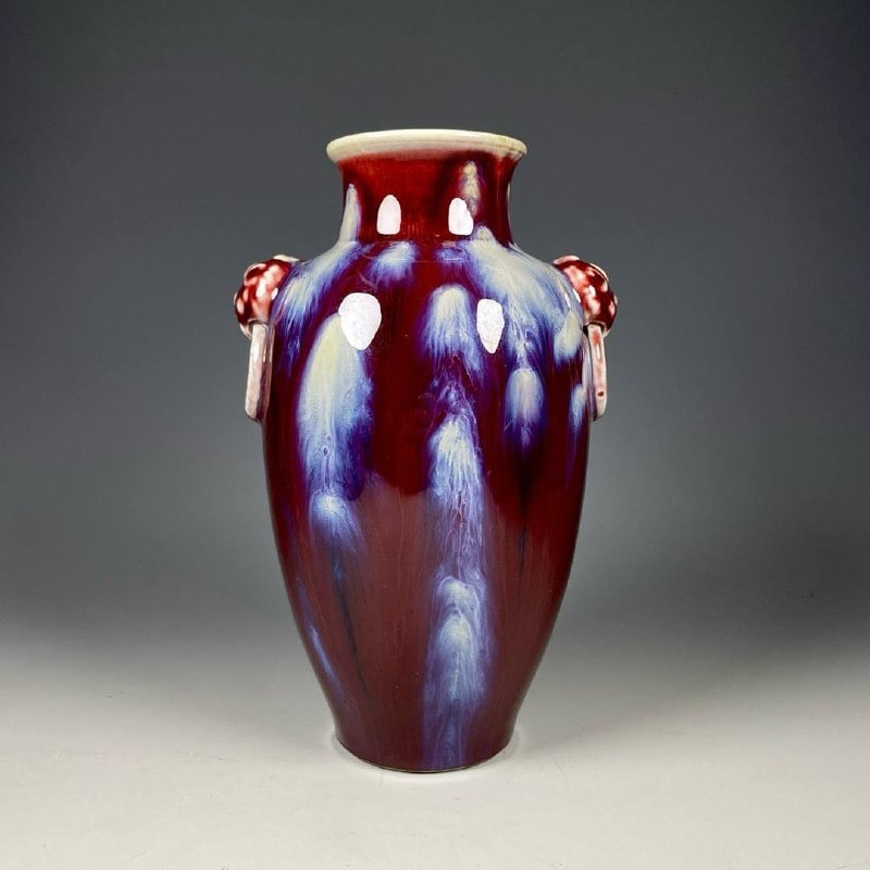 A kiln-fired vase with animal-shaped handles: A kiln-fired vase with animal-shaped handles, dating from the Yongzheng period. Height: 19cm; Width: 12cm.