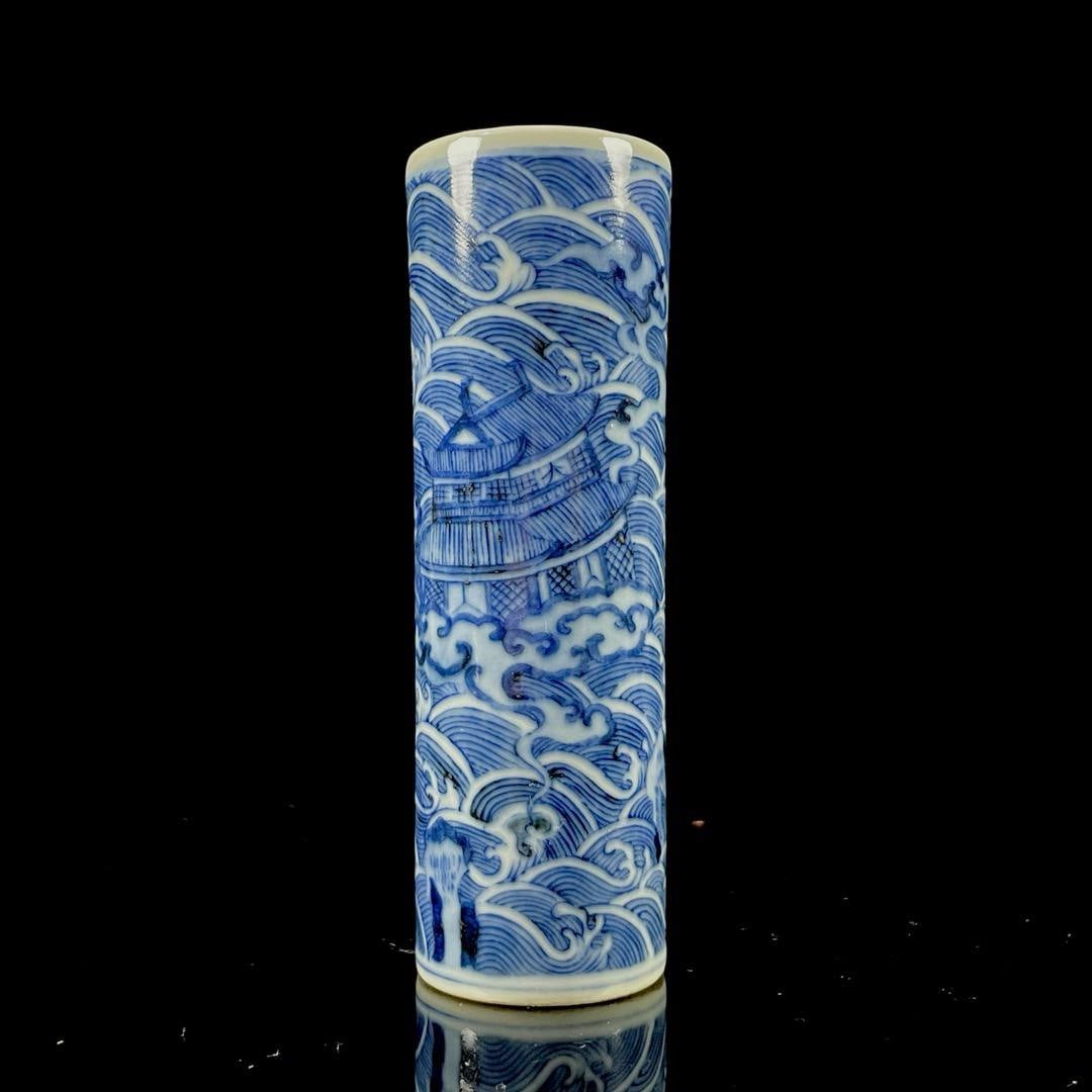 Qianlong reign of the Qing Dynasty. Blue and white porcelain brush pot: Qianlong reign of the Qing Dynasty. Blue and white porcelain brush pot depicting the "Flooding of Jinshan Temple" scene. Height: 11.5 cm. Width: 4 cm.
