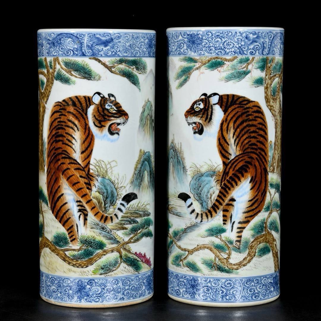 A pair of famille rose hat stands with a majestic tiger: A pair of famille rose hat stands with a majestic tiger motif, painted by Bi Yuanming during the Republic of China period; 28.5 x 12.5 cm.