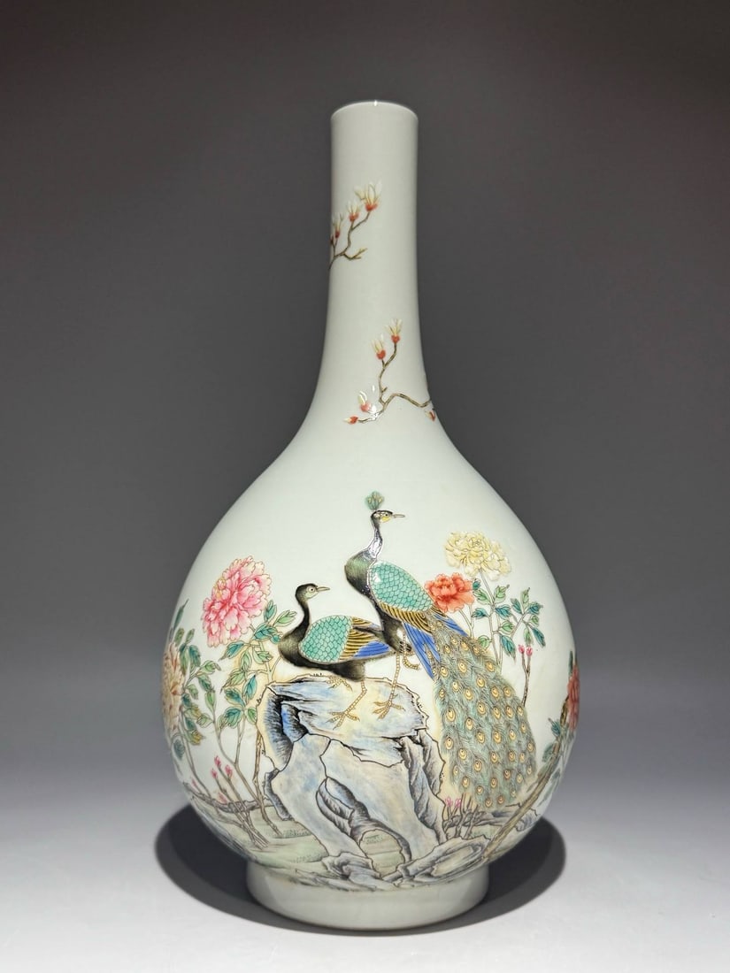 A famille rose vase with phoenix, magnolia, peony, and bird motifs: A famille rose vase with phoenix, magnolia, peony, and bird motifs, dating to the Yongzheng period of the Qing dynasty. Height: 35cm Width: 18cm