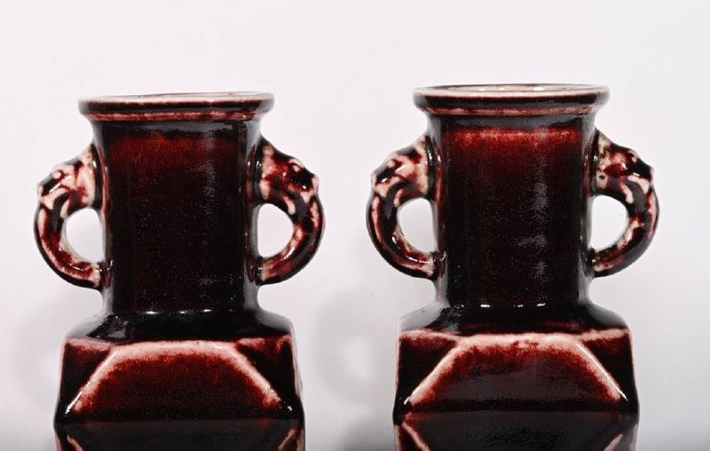A sacrificial red glazed pair vases with rounded handles: A sacrificial red glazed vase with rounded handles, made during the Xuande reign of the Ming Dynasty, measuring 18 x 11 cm in height.