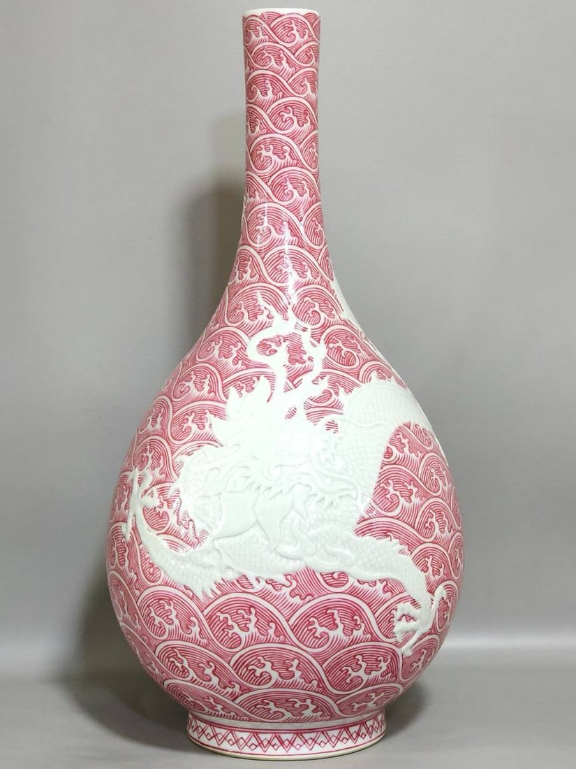 A Qing Dynasty Yongzheng period rouge-red carved long-necked vase (1 of 8)