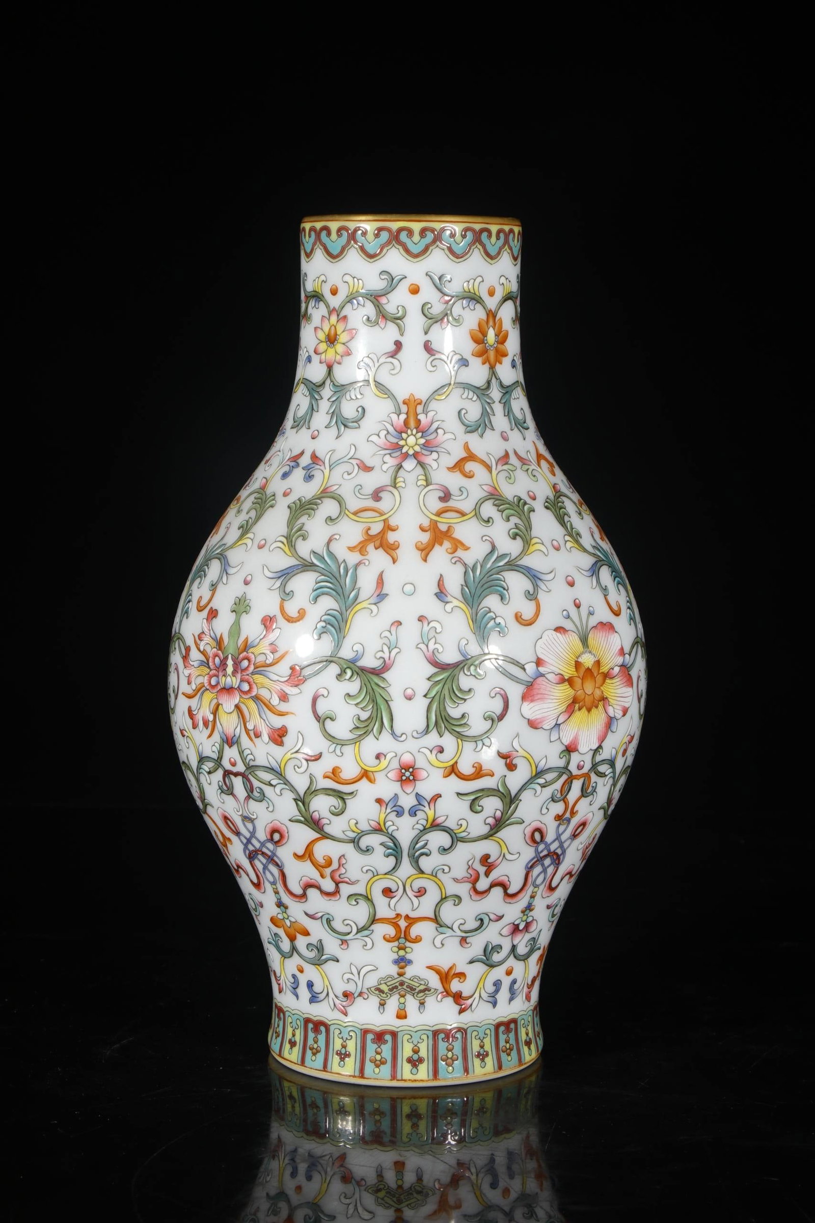 A Qing Dynasty Qianlong period enamel-painted lotus lantern vase: A Qing Dynasty Qianlong period enamel-painted lotus lantern vase, 27 cm high, 7 cm in mouth diameter, and 8.5 cm in base diameter,