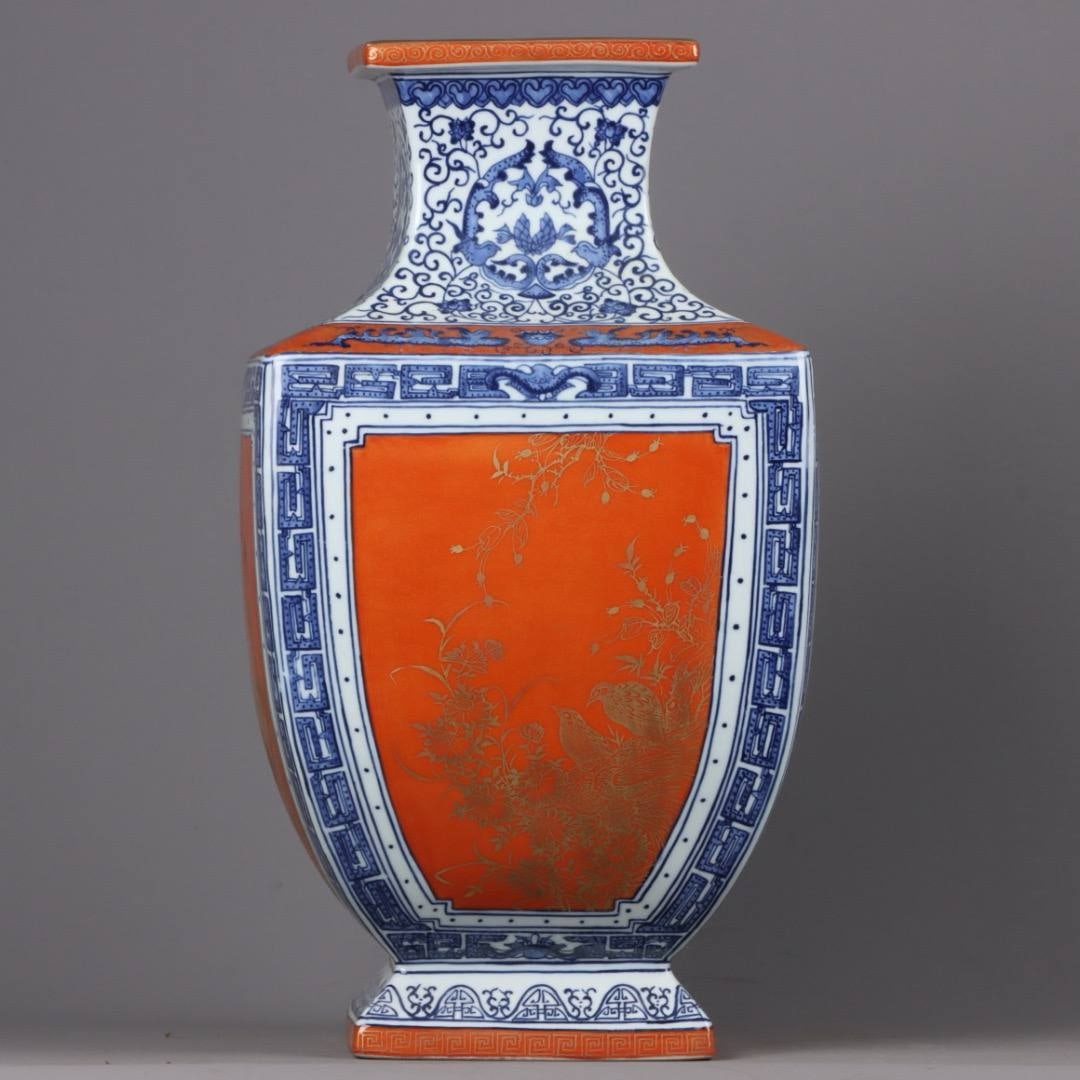 square vases with blue and white porcelain and iron-red gilt floral and bird designs: square vases with blue and white porcelain and iron-red gilt floral and bird designs, dating from the Qianlong period of the Qing dynasty. Height and width: 41.5 x 22 cm