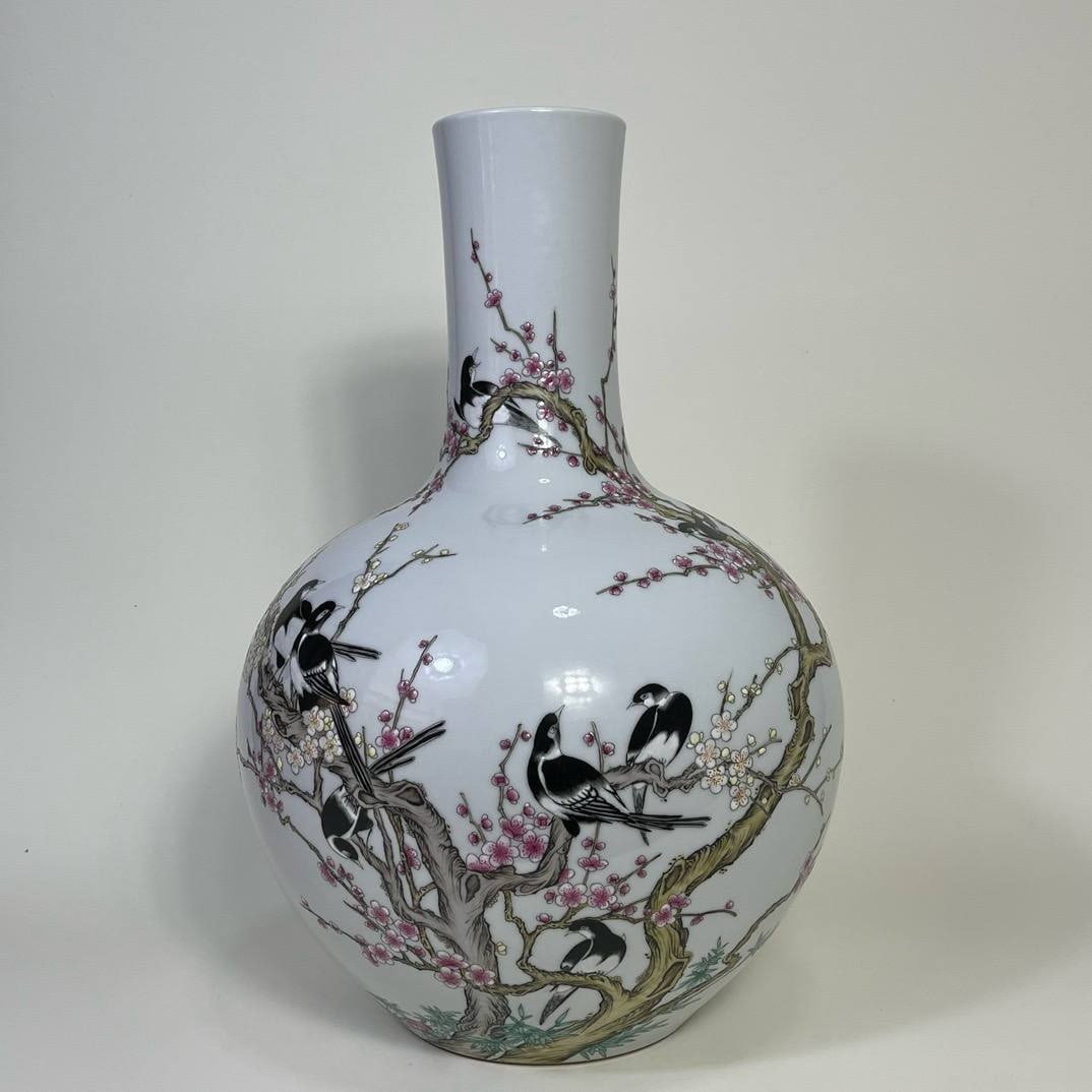 A famille rose vase with twelve auspicious spring designs from the Qianlong period (1 of 8)