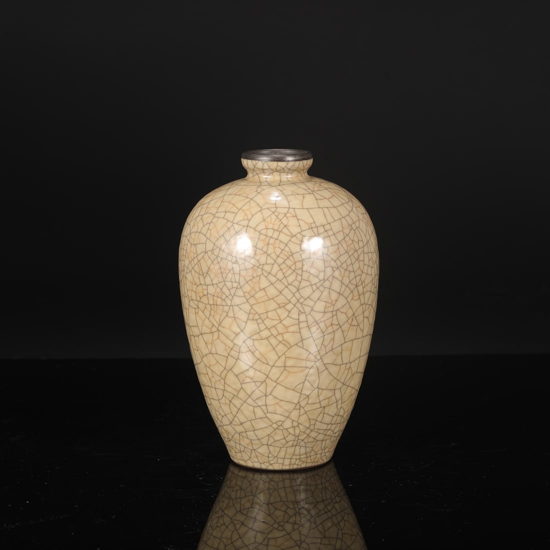 A large Northern Song Dynasty Ge ware vase with a beige glaze and silver rim, formerly in the: Dimensions: Height 22.5 cm, Mouth diameter 5 cm, Belly diameter 13.5 cm.
