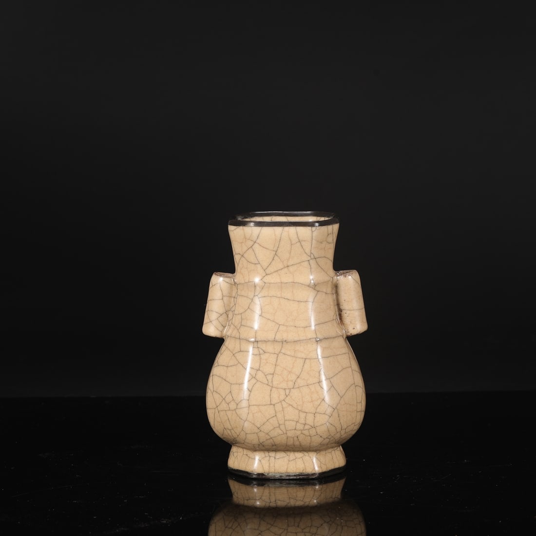 A Northern Song Dynasty Ge ware octagonal vase with a beige glaze and silver inlay, formerly in the: Dimensions: Height 21.5 cm, Mouth diameter 9 cm, Belly diameter 12.5 cm.