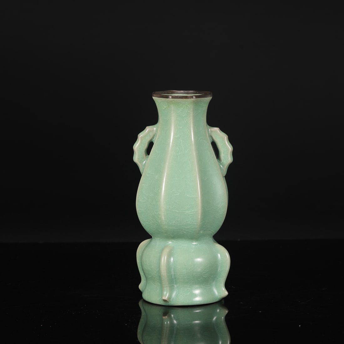 A Northern Song Dynasty Ru ware vase with jade-green glaze and silver-rimmed handles, from a: Dimensions: Height 22 cm, Mouth diameter 6 cm, Belly diameter 9.5 cm.