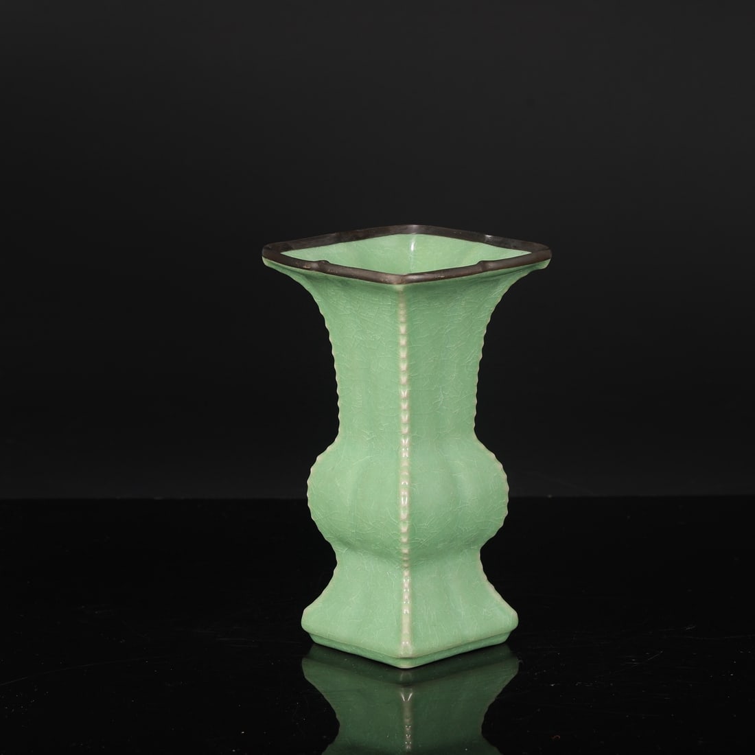 A Northern Song Dynasty Ru ware piece with a jade-green glaze, inlaid with silver clasp, featuring a: Dimensions: Height 22.5 cm, Mouth Diameter 12.5 cm, Belly Diameter 8 cm.