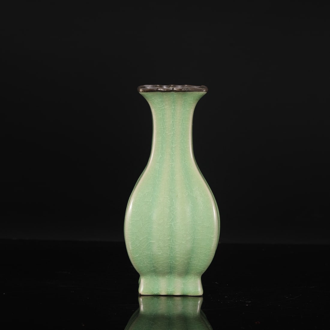 A Northern Song Dynasty Ru ware square melon-shaped vase with jade-green glaze and silver clasp,: Dimensions: Height 21 cm, Mouth diameter 7 cm, Belly diameter 9 cm.
