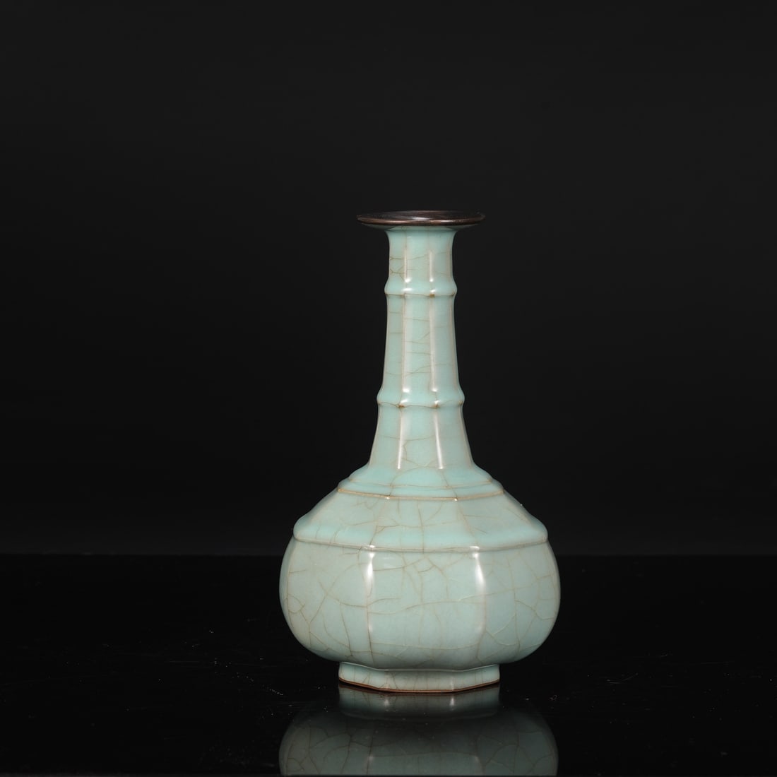 A Southern Song Dynasty official kiln celadon octagonal bamboo-knot vase with silver clasp,: Dimensions: Height 24 cm, Mouth diameter 6.5 cm, Belly diameter 13.5 cm.