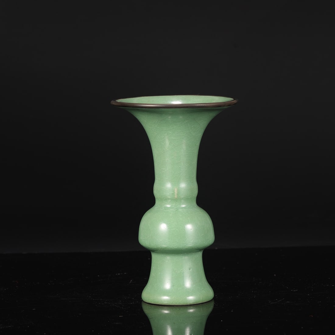 A Northern Song Dynasty Ru ware piece with a jade-green glaze, ice-crack pattern, and silver clasp,: Dimensions: Height 22.5 cm, Mouth Diameter 13.5 cm, Belly Diameter 8 cm.