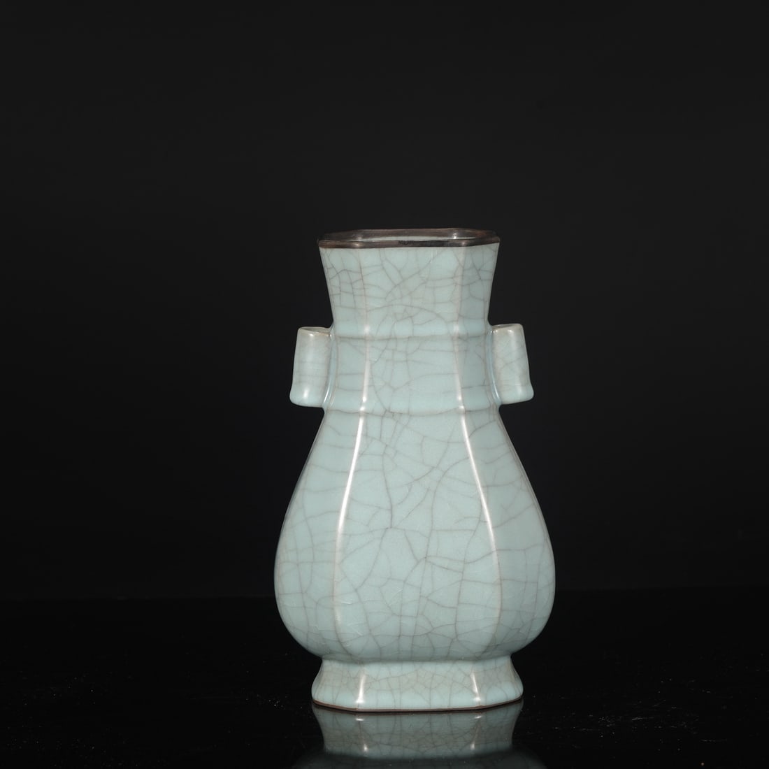 A Southern Song Dynasty official kiln celadon octagonal vase with silver clasps and tubular handles,: Dimensions: Height 25 cm, Mouth diameter 9.5 cm, Belly diameter 14.5 cm.