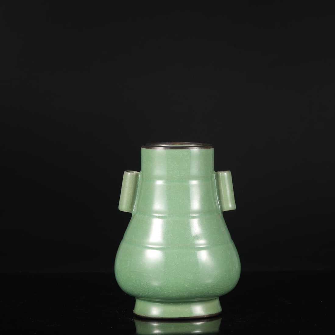 A Northern Song Dynasty Ru ware vase with jade-green glaze, ice-crack pattern, and silver-rimmed: Dimensions: Height 22 cm, Mouth Diameter 9 cm, Belly Diameter 15 cm.