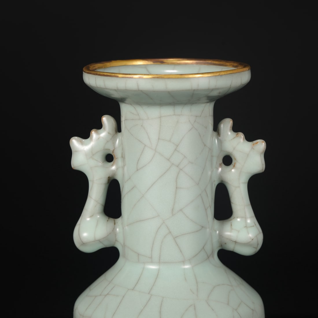 A Southern Song Dynasty official kiln celadon vase with gold-inlaid phoenix-ear handles, formerly in: Dimensions: Height 23 cm, Mouth diameter 8.8 cm, Belly diameter 9.5 cm.