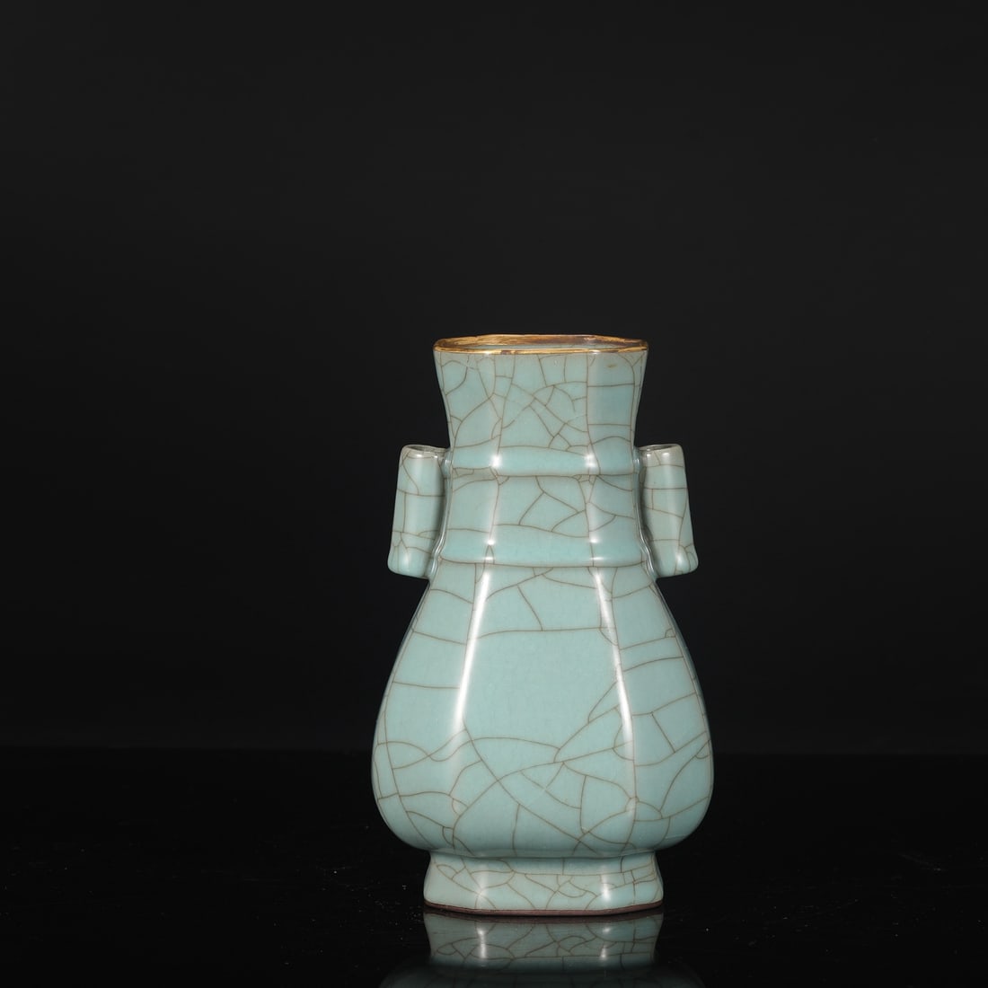 A Southern Song Dynasty official kiln celadon octagonal bamboo-knot vase with gold-inlaid rim, from: Dimensions: Height 22.5 cm, Mouth diameter 8.5 cm, Belly diameter 12.5 cm.