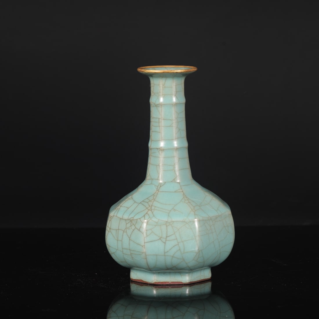 A Southern Song Dynasty official kiln celadon octagonal bamboo-knot vase with gold-inlaid rim, from: Dimensions: Height 23.5 cm, Mouth diameter 6.5 cm, Belly diameter 14 cm.