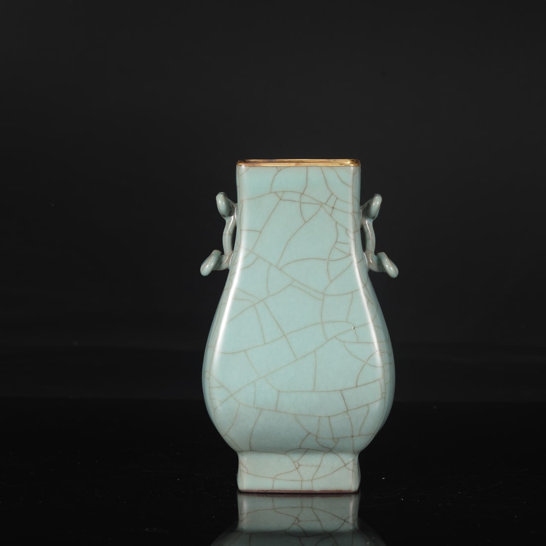 A Southern Song Dynasty official kiln celadon vase with gold-inlaid ruyi-shaped handles, from the: Dimensions: Height 22 cm, Mouth diameter 8 cm, Belly diameter 12 cm.