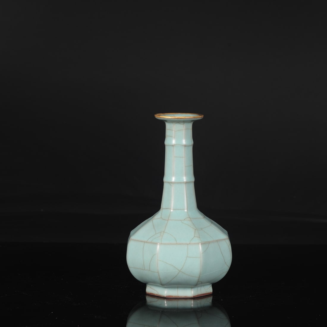 A Southern Song Dynasty official kiln celadon octagonal bamboo-knot vase with gold-inlaid rim, from: Dimensions: Height 23.5 cm, Mouth diameter 6.5 cm, Belly diameter 13.5 cm.