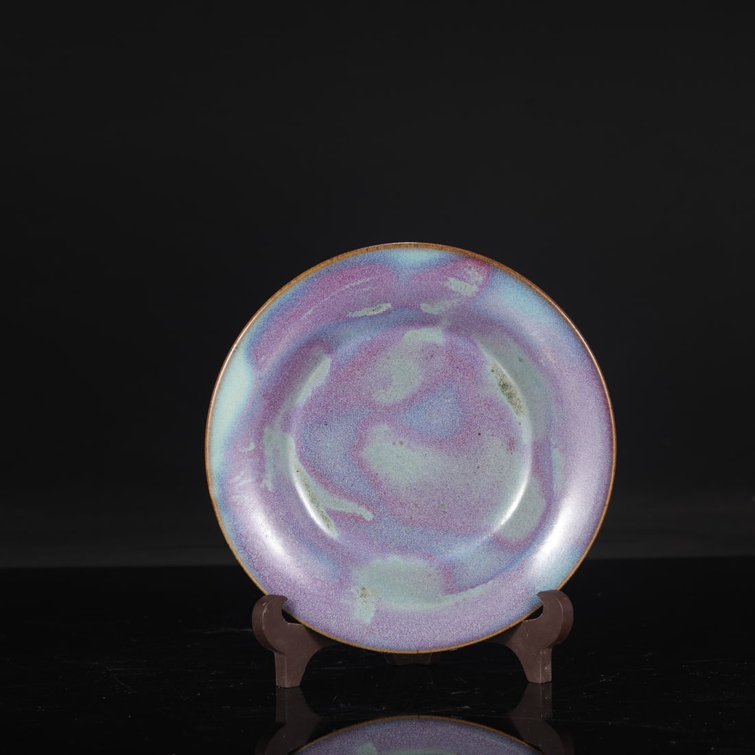 A large Northern Song Dynasty Jun ware dish with purplish-red spots and a folded rim, formerly in: Dimensions: Height 4 cm, Diameter 19.5 cm.