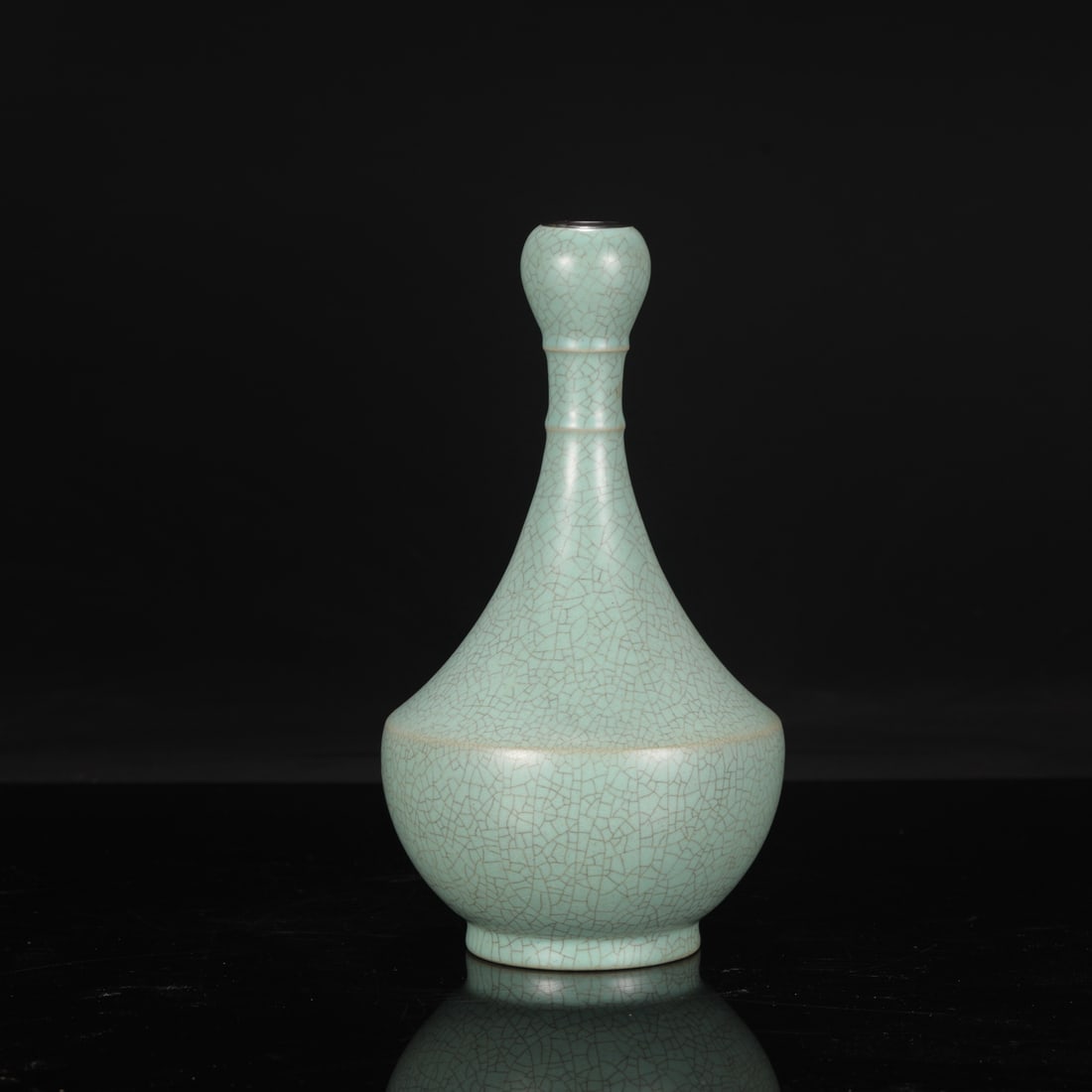 A Northern Song Dynasty Ru ware celadon-glazed garlic-head vase with silver rim, inscribed with an: Dimensions: Height 27 cm, Mouth diameter 2.5 cm, Belly diameter 14 cm.
