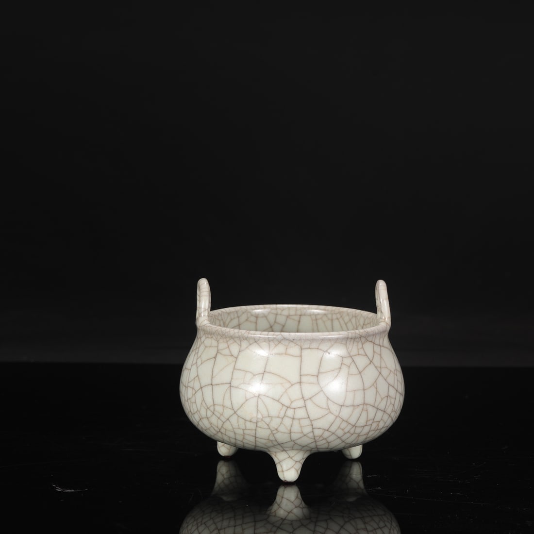 A Southern Song Dynasty official kiln celadon tripod censer with an inscription by Emperor Qianlong. (1 of 8)