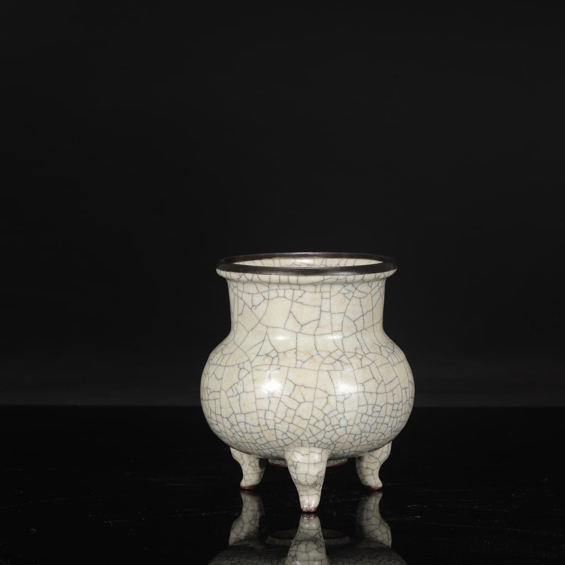 A Northern Song Dynasty Ge ware celadon-glazed tripod incense burner with silver clasps, formerly in: Dimensions: Height 16 cm, Mouth diameter 12 cm, Belly diameter 13 cm.