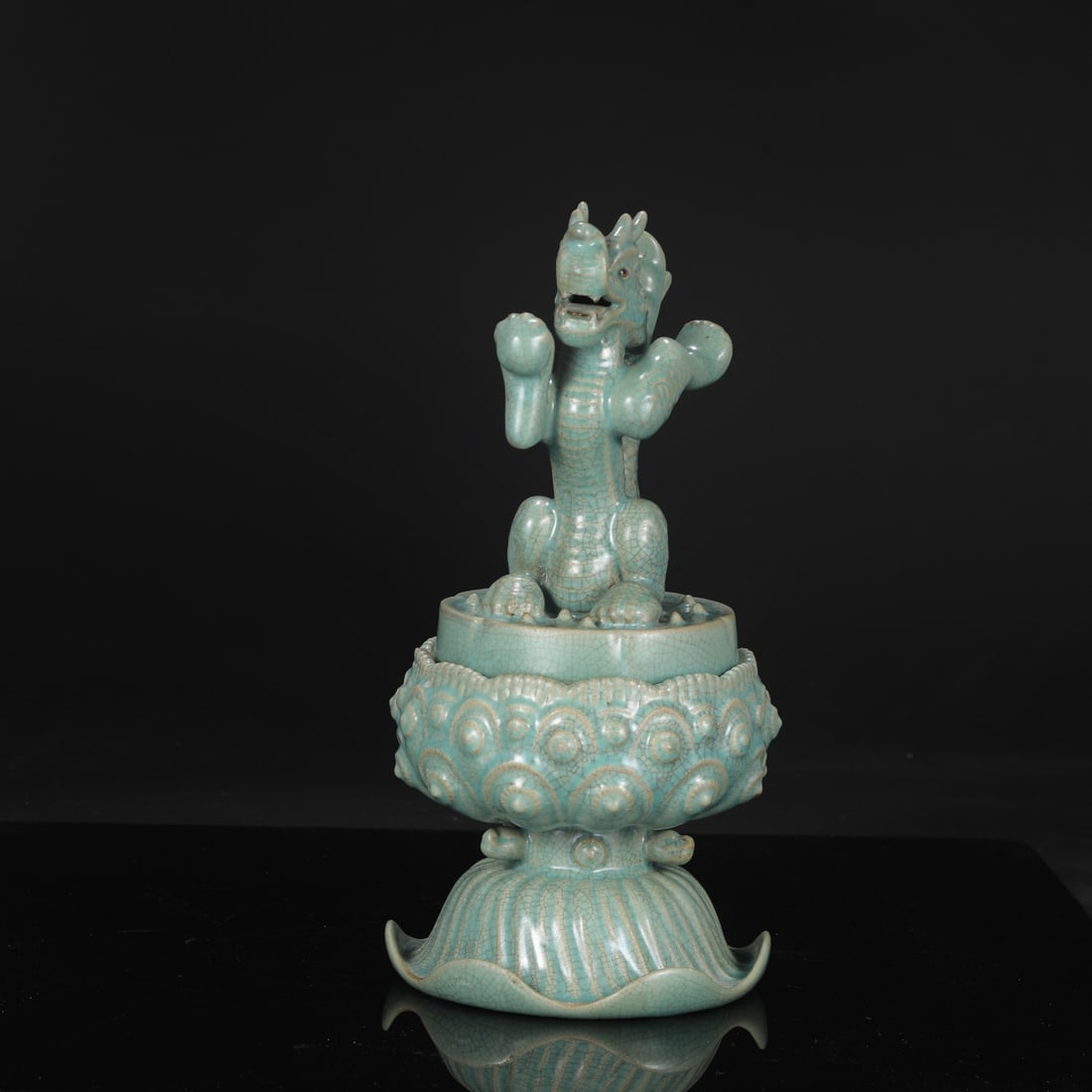 A large Northern Song Dynasty Ru ware celadon-glazed covered jar with molded dragon design, formerly: Dimensions: Height 37.5 cm, Mouth diameter 11 cm, Belly diameter 18 cm.