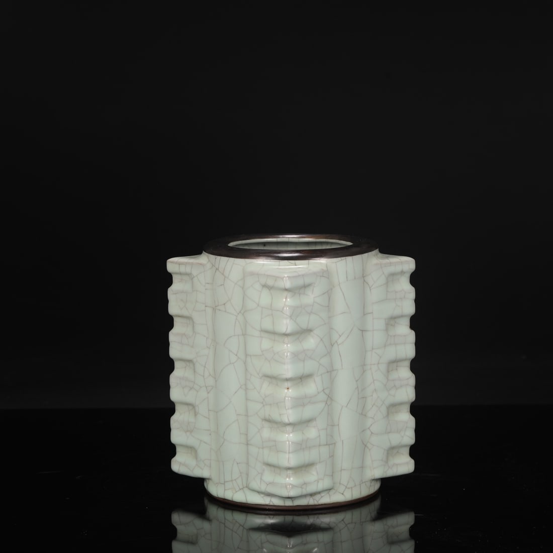 A large celadon-glazed cong-shaped vase from the Southern Song Dynasty official kiln, adorned with: Dimensions: Height 20 cm, Mouth Diameter 10 cm, Belly Diameter 14 cm.