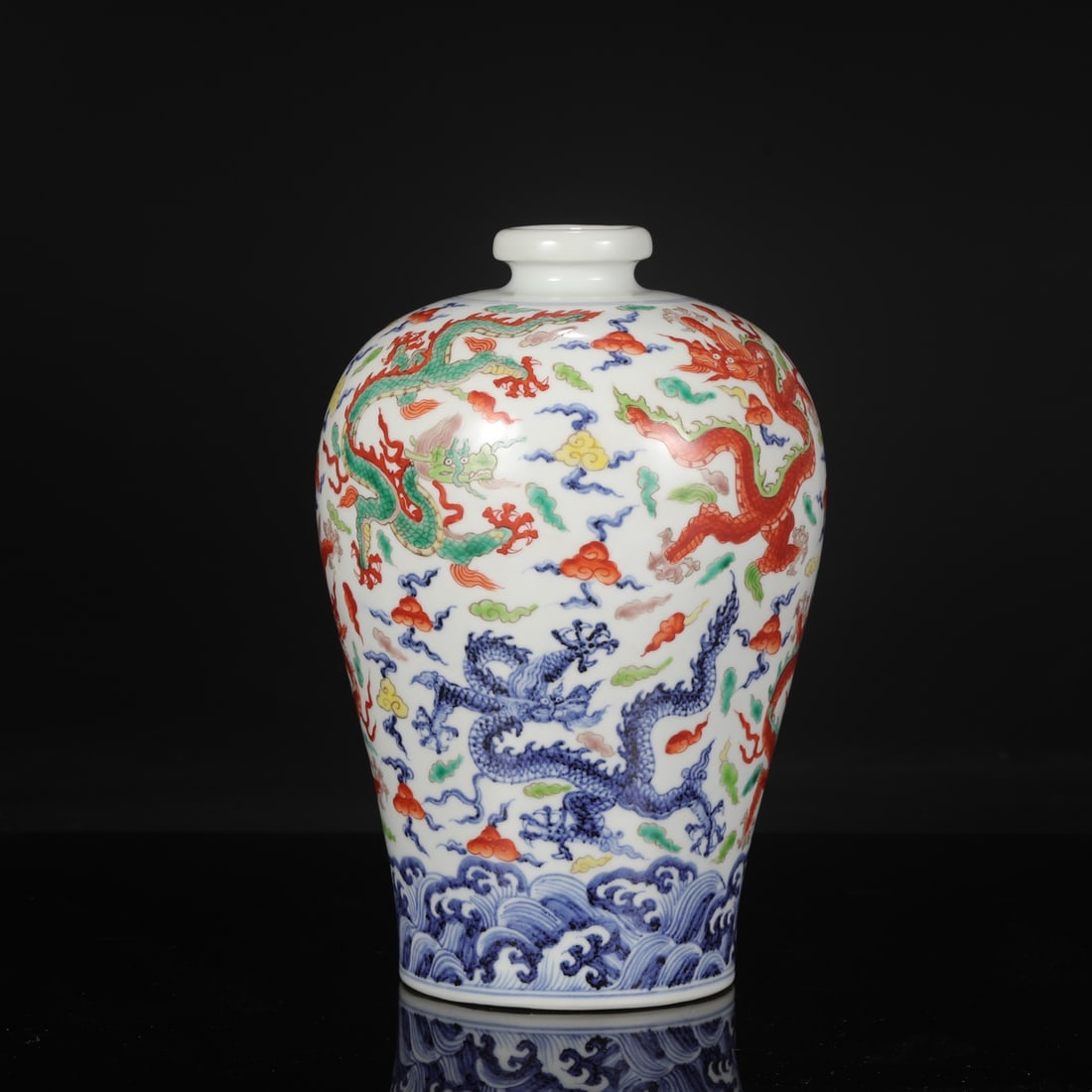 A large Ming dynasty Xuande blue-and-white porcelain plum vase with polychrome nine dragons amidst: Dimensions: Height 31 cm, Mouth diameter 6 cm, Belly diameter 20 cm.