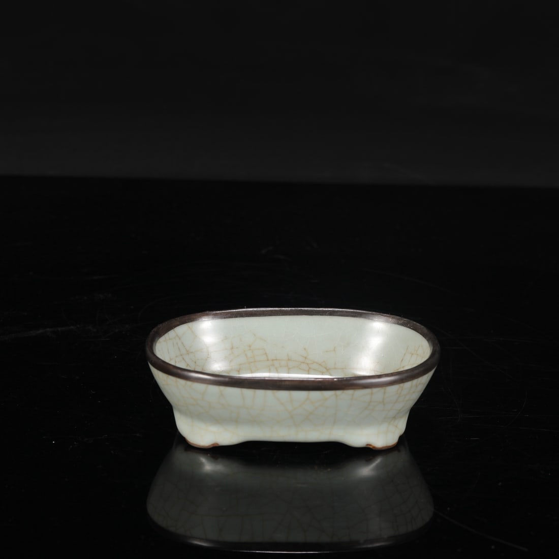A Southern Song Dynasty official kiln celadon narcissus basin with a silver rim, inscribed with an (1 of 8)